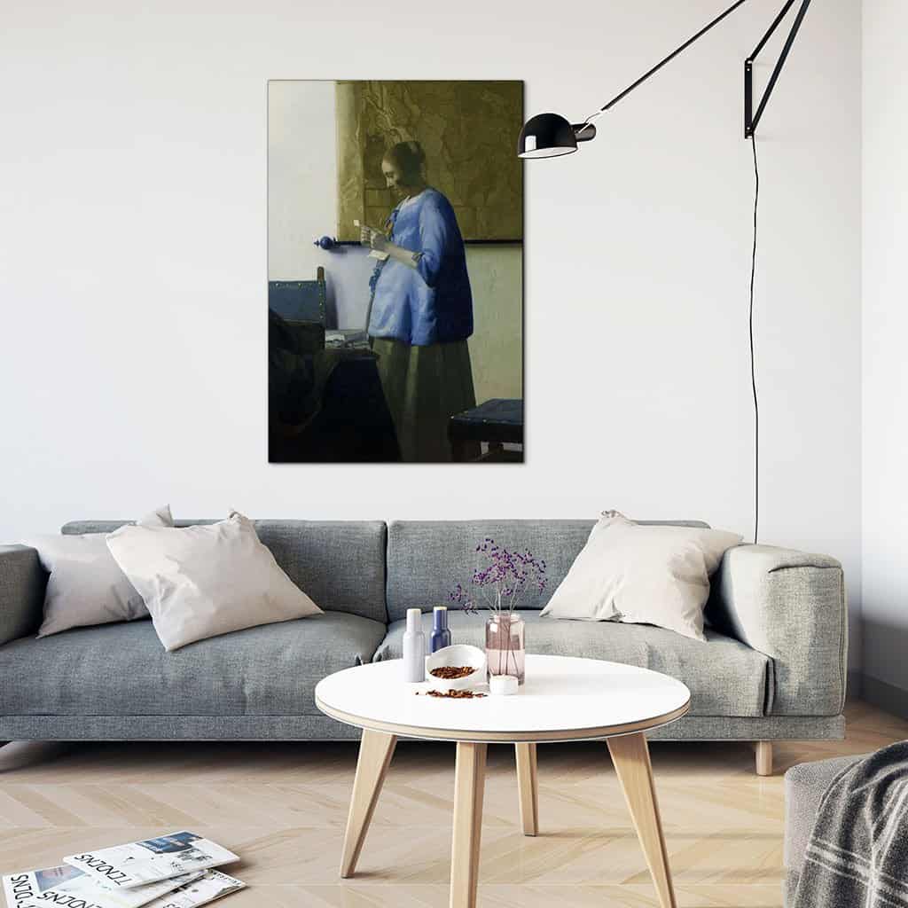 Vrouw in het blauw die een brief leest (Johannes Vermeer)