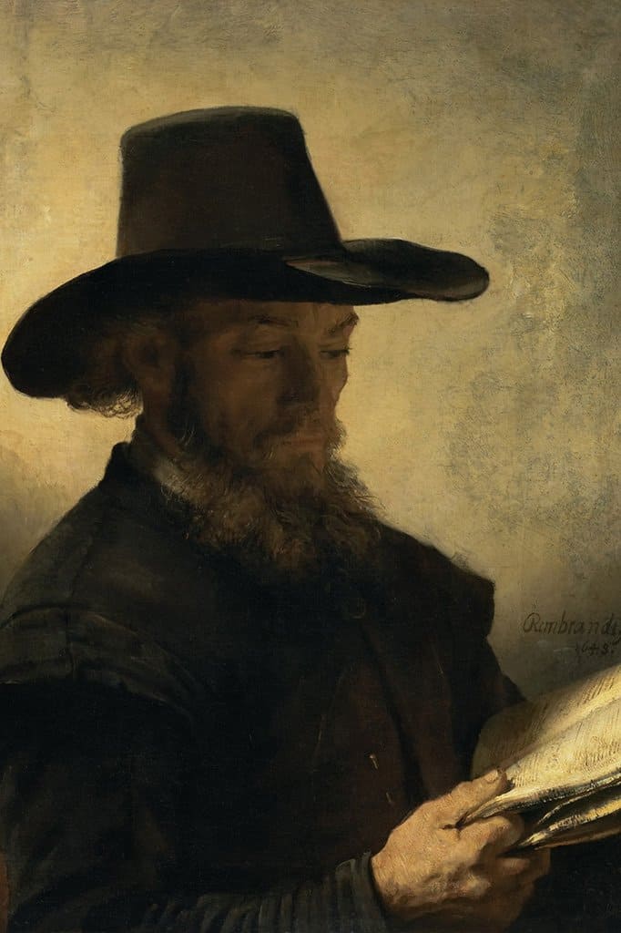 Portret van een man die bij kaarslicht leest (Rembrandt)