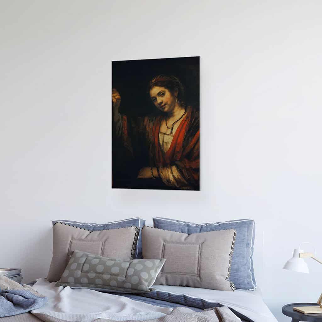 Vrouw bij een half open deur - Rembrandt