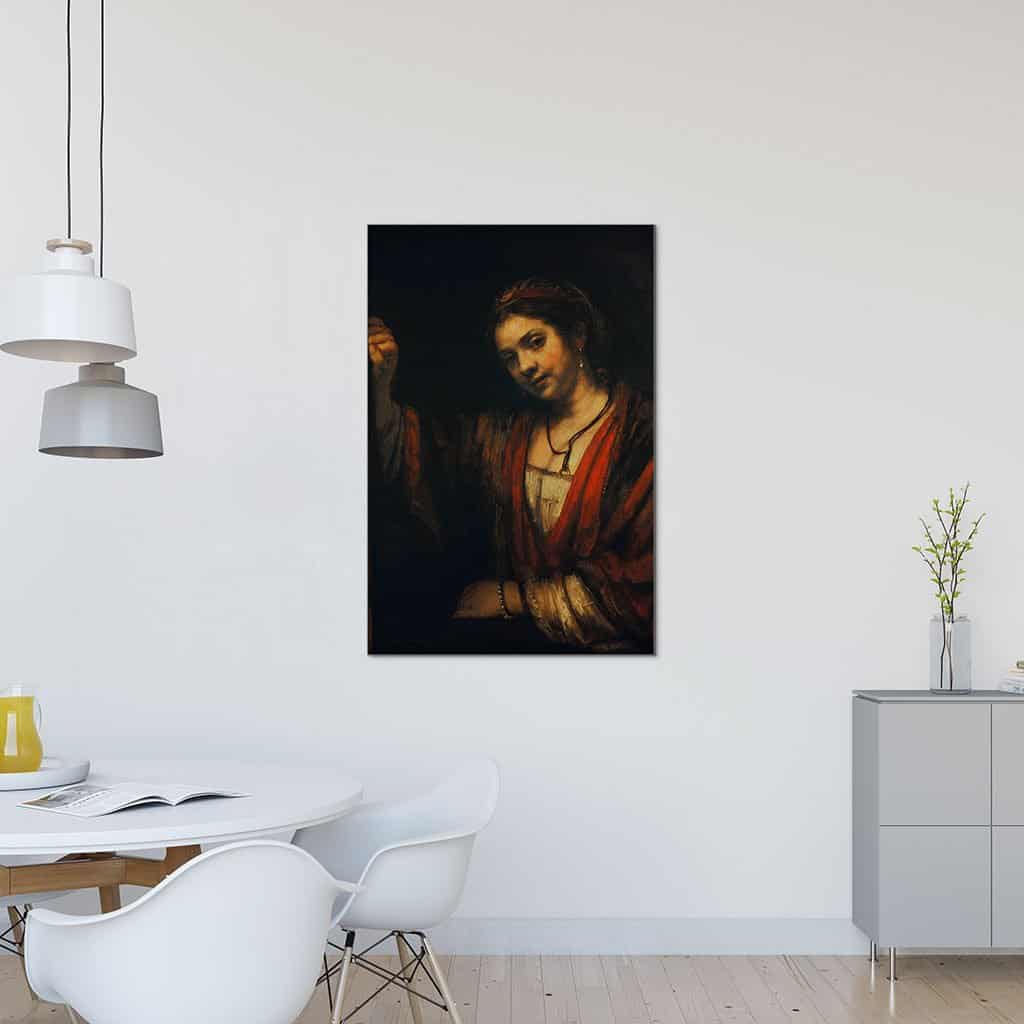 Vrouw bij een half open deur - Rembrandt