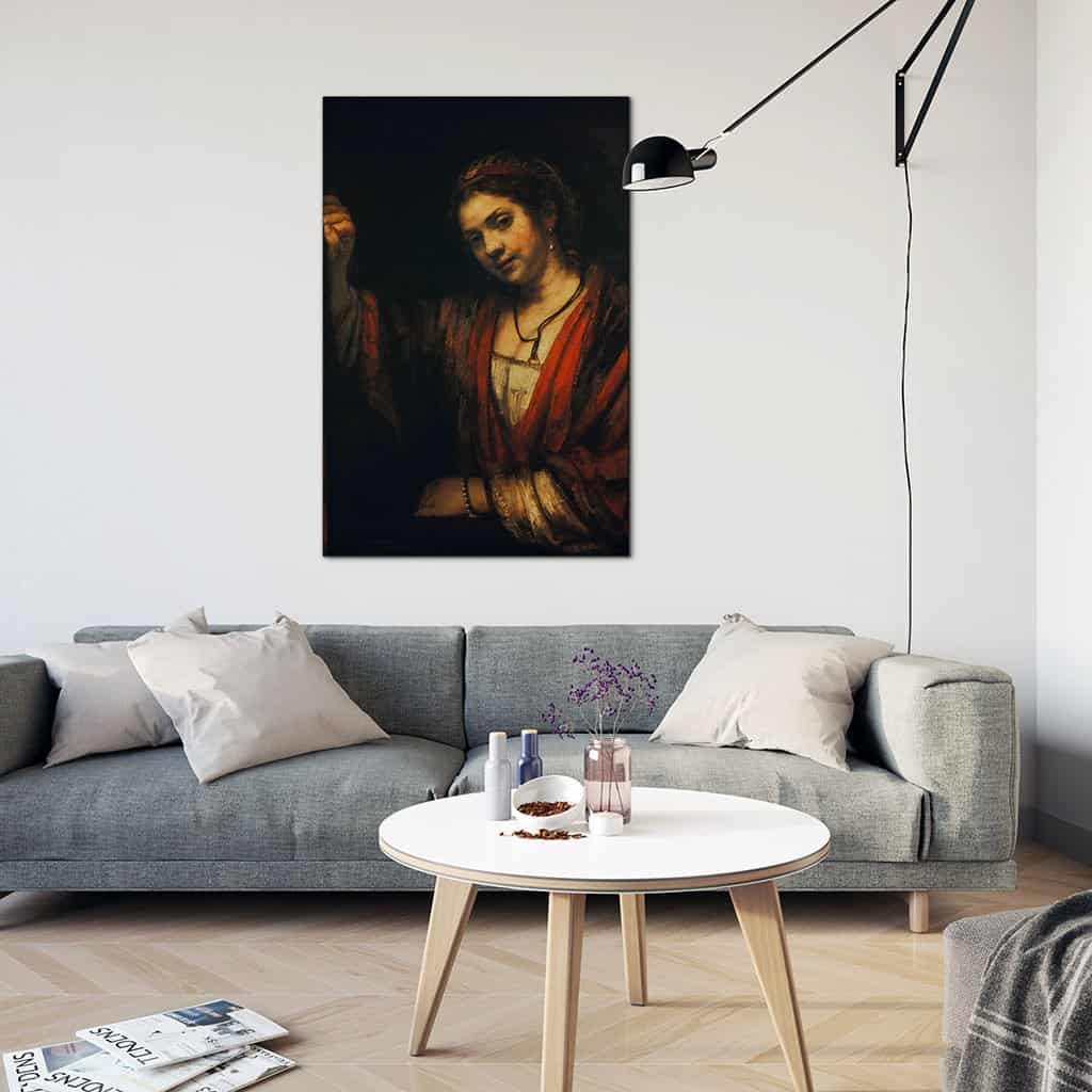 Vrouw bij een half open deur - Rembrandt