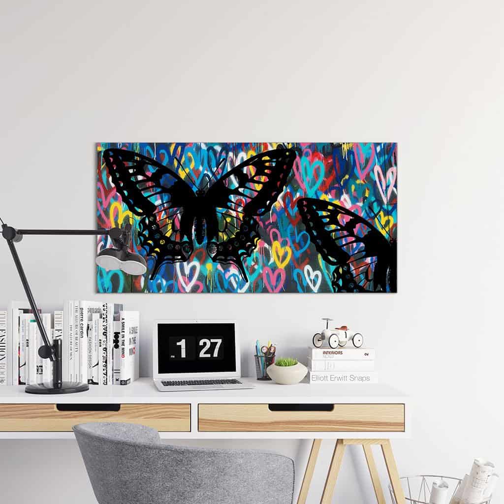 Stencil vlinders op de muur