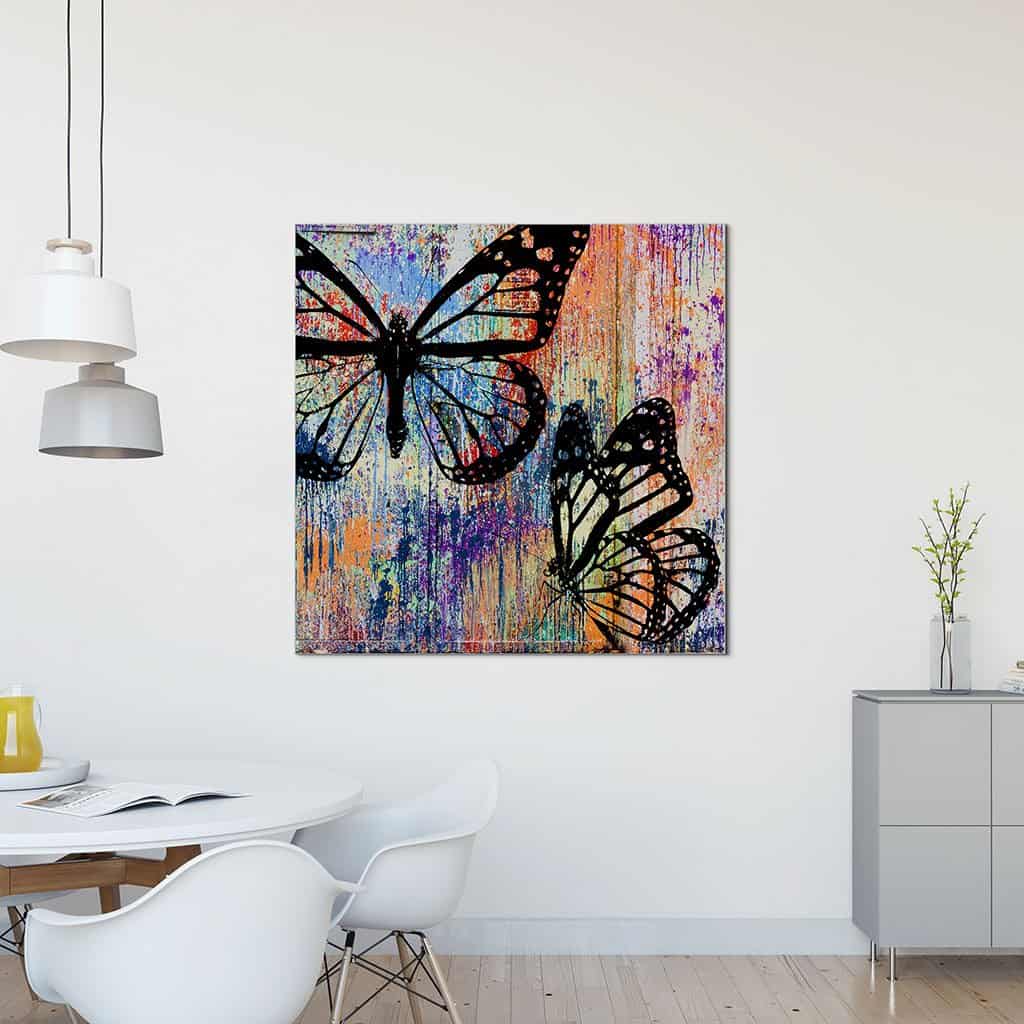 Stencil vlinders op de muur