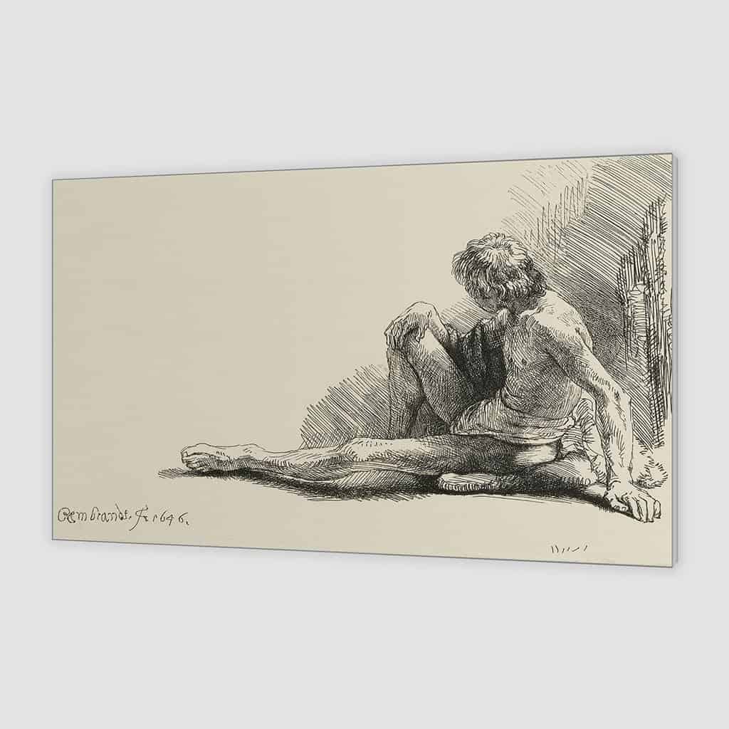 Jonge man, zittend op de vloer met een uitgestrekte been - Rembrandt